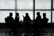© Pixel-Shot - Silhouette of business consultants working in office