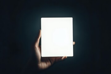 Aufkleber - Illuminated square held in hand against a dark background showcasing minimalist design and modern aesthetics