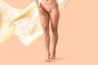 © Pixel-Shot - Beautiful young woman in underwear and smooth cloth on beige background. Hair removal concept