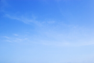 Wall Mural - fantastic soft white clouds against blue sky and copy space horizontal shape