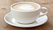 © Levi - White Cup of Latte Art Coffee on Wooden Table