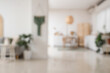 © Pixel-Shot - Interior of stylish studio apartment with living room and kitchen, blurred view