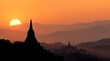 © Kadir Ibrahim - Minimalist Borobudur silhouette at sunrise, bathed in golden light with soft earth-tone sky. Clean, sacred vibe with space below for Waisak message or text.