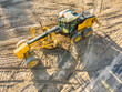 © Austockphoto - Aerial view of earthmoving machinery on a construction site