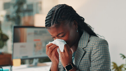 Poster - Sick, black woman and blowing nose with tissue at office for flu, cold or illness at night. Female person, employee or designer with influenza, sinus or allergy for symptoms or sneeze at workplace