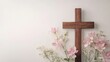 © Mitchell - Wooden cross with pink flowers easter background christianity religious symbol faith hope love salvation god