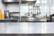 © zetrum - Empty stainless steel table in a professional kitchen with blurred equipment in the background