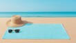 © Cdel - Beach Essentials on Golden Sand, a serene flat lay featuring a blue towel, straw hat, sunglasses, and flip-flops, embodying a tranquil coastal getaway atmosphere.