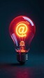 © Thiti - Creative e-marketing concept with glowing lightbulb and at symbol, internet, digital