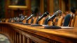 © irawan710 - Government hearing microphones on a wooden table