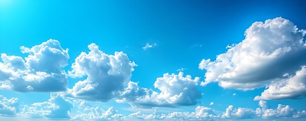 Fototapete - Fluffy White Clouds Illuminated by Soft Natural Light in a Clear Sky : Generative AI