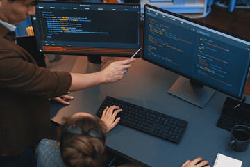 Wall Mural - top view of it developers discussing with point to intelligent website development coder system runn