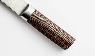 A close up shows the elegant wooden handle and polished silver bolster of a knife on white.