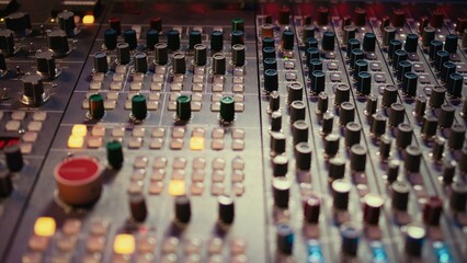 Leinwandbilder - Pre amp knobs and switchers on mixing console panel board, audio stereo equipment used in music post production. Empty control room in professional studio, fader and sliders. Close up.