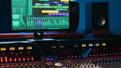 Fototapete - Professional studio control room with pre amp knobs and faders, key buttons on recording desk, soundproof space. Audio mixer and regulator used to produce music, technical equipment.