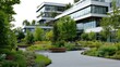 © leymart - Modern office building courtyard with lush landscaping, featuring paved walkways, benches, and diverse flora.