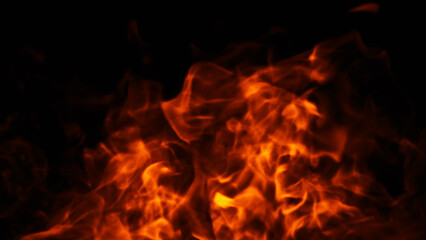 Wall Mural - blurred texture of burn fire with particles embers. blur flames on isolated black background. textur