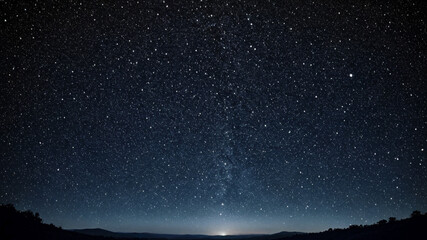 Stunning Night Sky Full of Stars Over a Silhouette Landscape