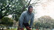 © peopleimages.com - Fitness, man and tired with headphones at park for running fatigue, workout recovery and cardio challenge. Athlete, black person and resting in nature with breathing break, exercise music and podcast