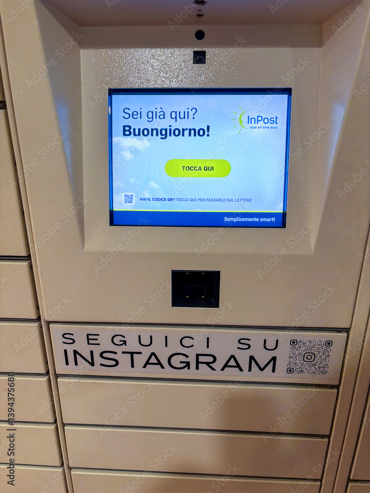 InPost locker terminal with welcome screen at Città Fiera mall in Udine ...