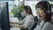 © hasanstudio - Professional woman in headset smiling at work