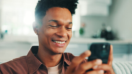 Fototapete - Student, smile and phone with man on sofa for college acceptance, relax and online portal. Scholarship news, university application and research with person in living room at home for results