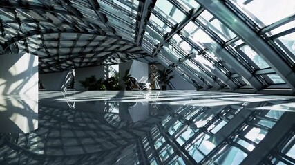 Poster - Modern architectural design featuring sleek glass structures and reflections in a spacious interior