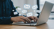 © StockWorld - Email Overload: Hands Typing on Laptop with Floating Email Icons - Managing Inbox, Productivity & Communication