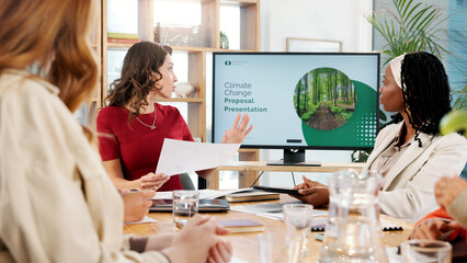 Poster - Woman, talking and presentation for climate change in office, planning and ideas of environment solution. People, meeting and brainstorming with proposal documents, eco friendly information and tips