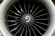 © Connect Images - Close-up of a large aircraft engine turbine with visible fan blades.