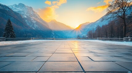 Wall Mural - Majestic Winter Sunrise over Snowy Mountain Peaks Illuminating a Stone Terrace with Golden Light and Serene Atmosphere