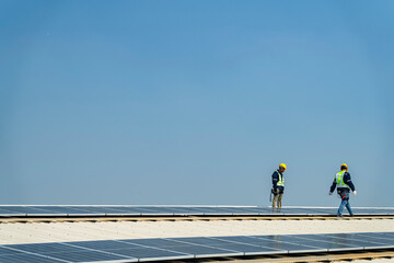 Wall Mural - team of professionals installs solar panels, ensuring energy efficiency and sustainable development.