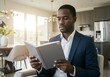 © GS-Studio - Focused Business Professional Reading a Book at Home