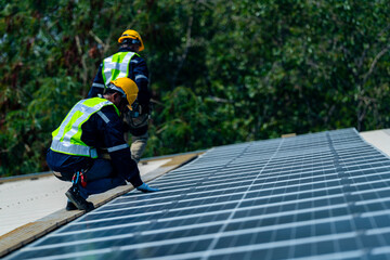 Wall Mural - team of professionals installs solar panels, ensuring energy efficiency and sustainable development.