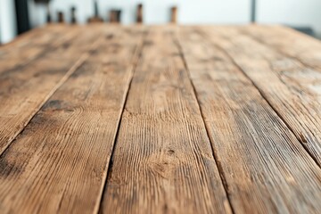 Poster - Weathered wooden tabletop in a cozy workshop setting with blurred vintage tools