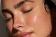 © Inspire Shots Hub - Close-up of a woman's face, skin glistening with water droplets, eyes closed, showcasing a healthy, hydrated complexion, representing skincare, beauty, and well-being.