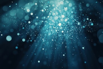 Wall Mural - ethereal blue light particles and rays in a dark background