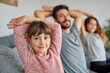 © Natalia - Happy family practicing evening stretching at home
