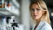 © elena - A scientist working in a high-tech lab, examining samples under a microscope