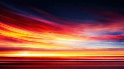 Wall Mural - a vibrant red-orange sky blends into the distant blue horizon, while fluffy clouds dot the foregroun