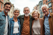 © miss irine - Happy senior friends standing together at city. Group of elderly adult people smiling at camera. Mature retirees, enjoying free time on vacation. Friendship and bonding on a trip. Positive lifestyle.