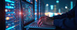 © miss irine - specialist works on laptop in data center. Engineer uses computer to manage database server. Digital tech support, telecommunication system maintenance concept. Modern infrastructure, cybersecurity.
