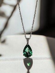 Poster - Stunning Green Teardrop Pendant Necklace Elegantly Displayed in Soft Natural Light : Generative AI
