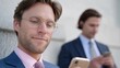 © Kharkovich - Young caucasian males in formal attire using smartphones outdoors