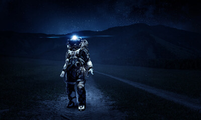 Wall Mural - astronaut walking on an unexplored planet