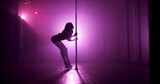 Woman, dancing or pole with stage for silhouette, tease performance or sexy movement in nightclub. Theater, spotlight and female person in routine for seduction, stripping and party entertainment