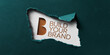 © Mirivox - Torn teal paper reveals white card with bronze 'B' and 'Build Your Brand' text, showcasing a business branding concept, ideal for marketing or advertising mockups