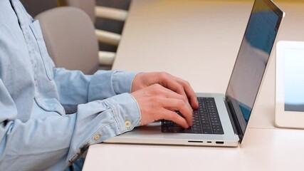 Canvas Print - fingers on a laptop keyboard close-up, code development concept, typing on a keyboard.