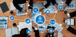 © InfiniteFlow - Aerial view of a collaborative business meeting showcasing a CRM system, data charts, and professionals engaging in strategic discussions in a modern office. Amity