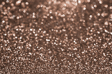 Wall Mural - mocha mousse, brown sparkling glitter bokeh background, abstract defocused texture. holiday lights. 